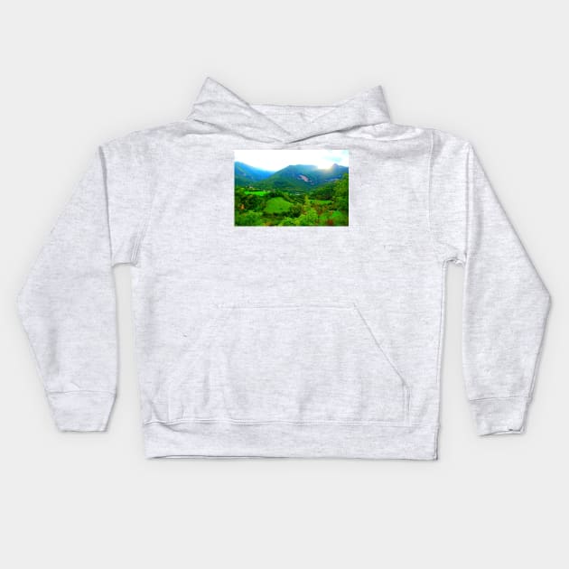 View from Sarnano at the Sibillini Mountains, hills, cattle, buildings Kids Hoodie by KristinaDrozd